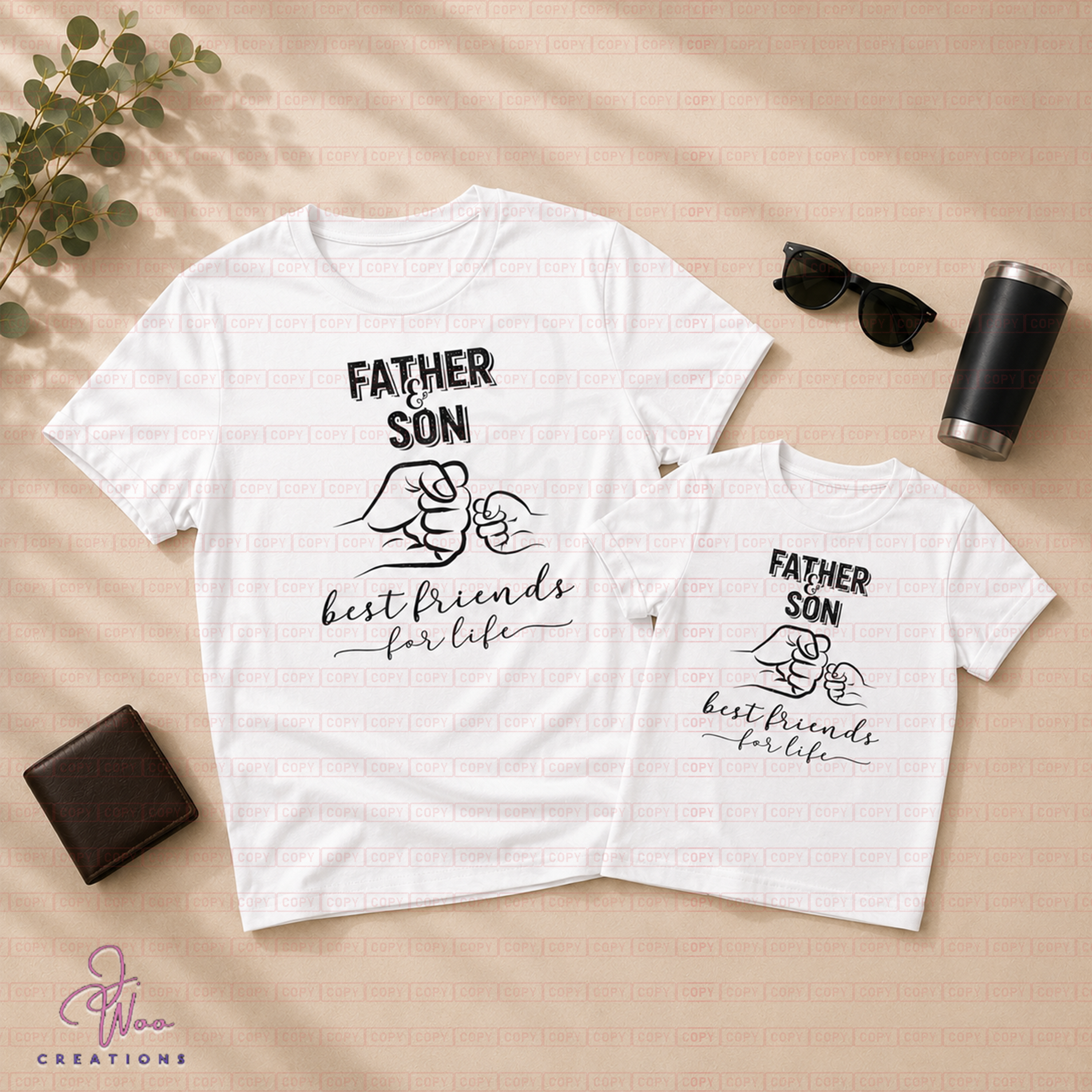 Two white t-shirts with 'Father Son Best Friends for Life' design on a beige surface with sunglasses and a tumbler.