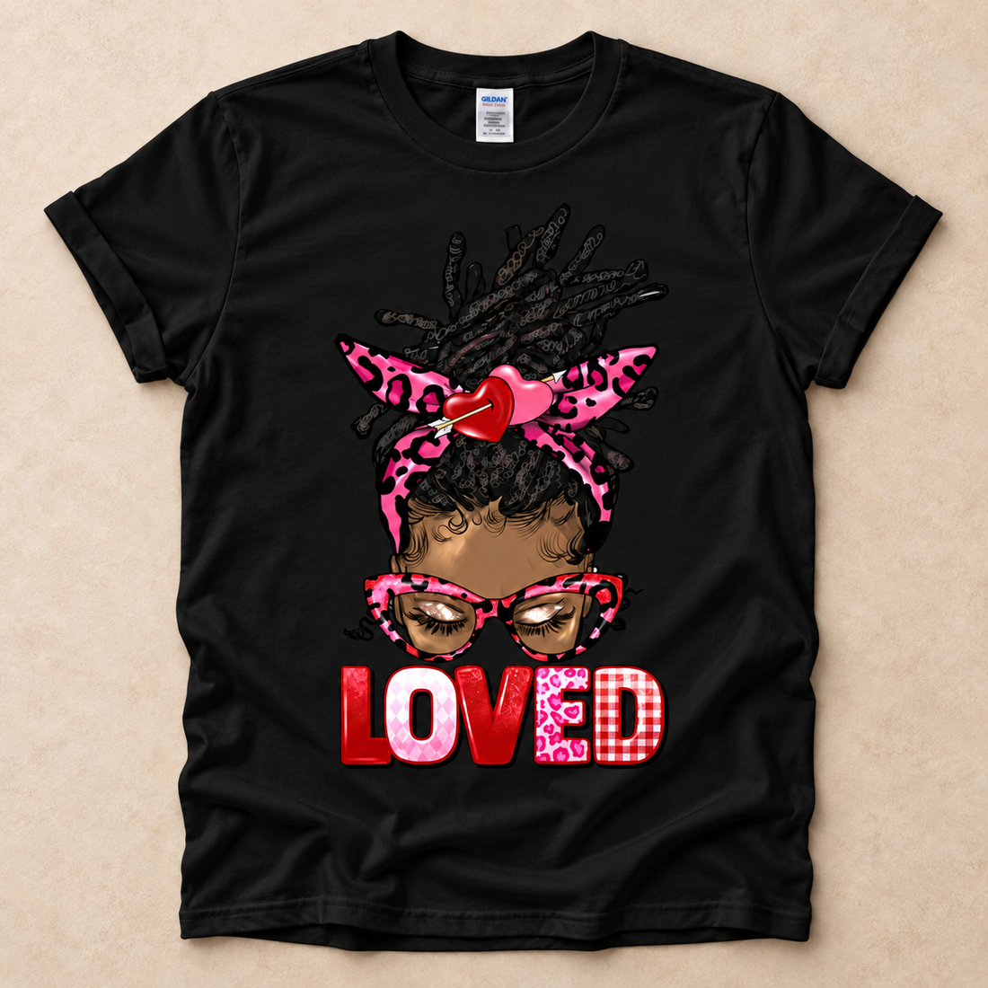 White Loved Locs graphic T-shirt featuring an illustrated Black woman with locs and bold red LOVED lettering